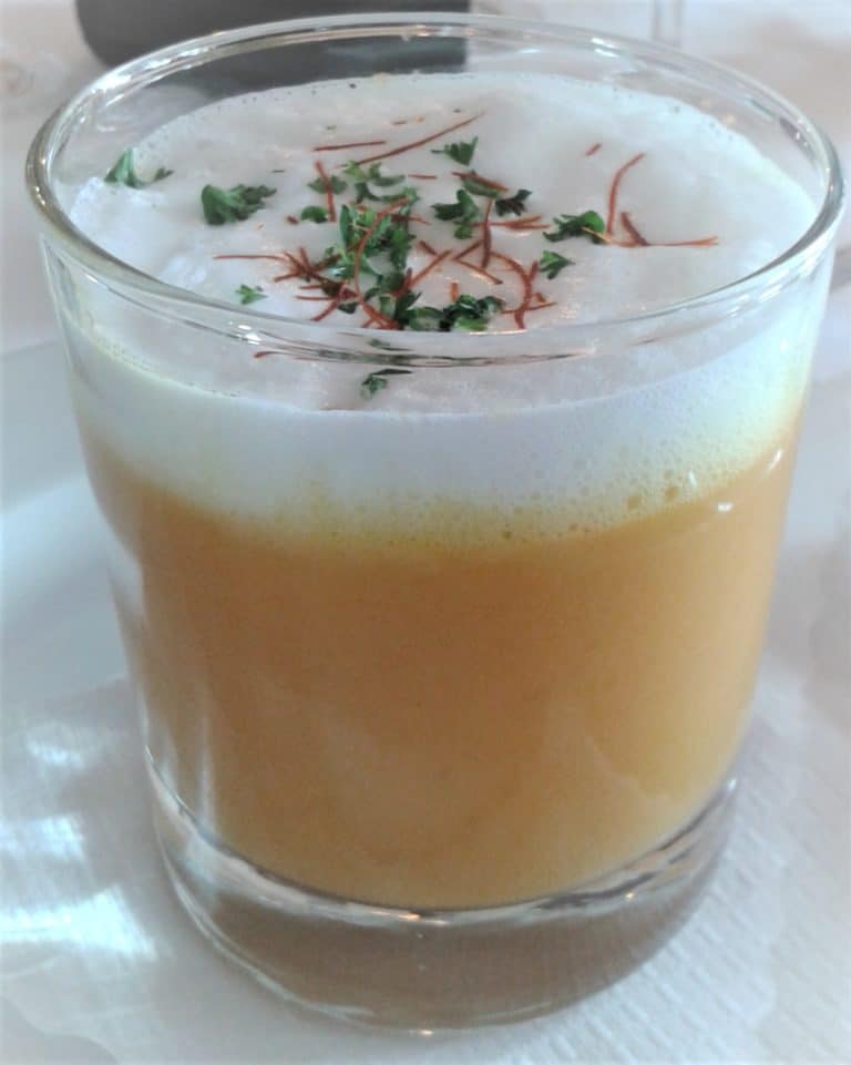 20140222_123921 (2) – Hubertus Boltenhagen Creamy soup in a glass, garnished with foam and fresh herbs.