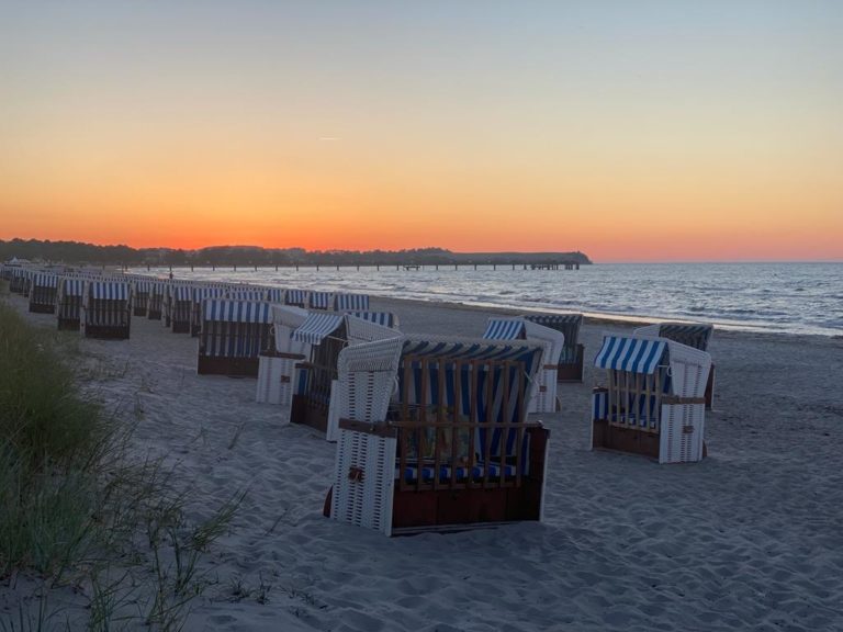 IMG-20220625-WA0000 – Hubertus Boltenhagen Beach chairs on the sandy beach at sunset, tranquil seaside setting.