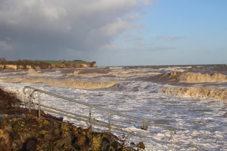 IMG_1900 – Hubertus Boltenhagen Stormy seas with foaming waves and cloudy skies.