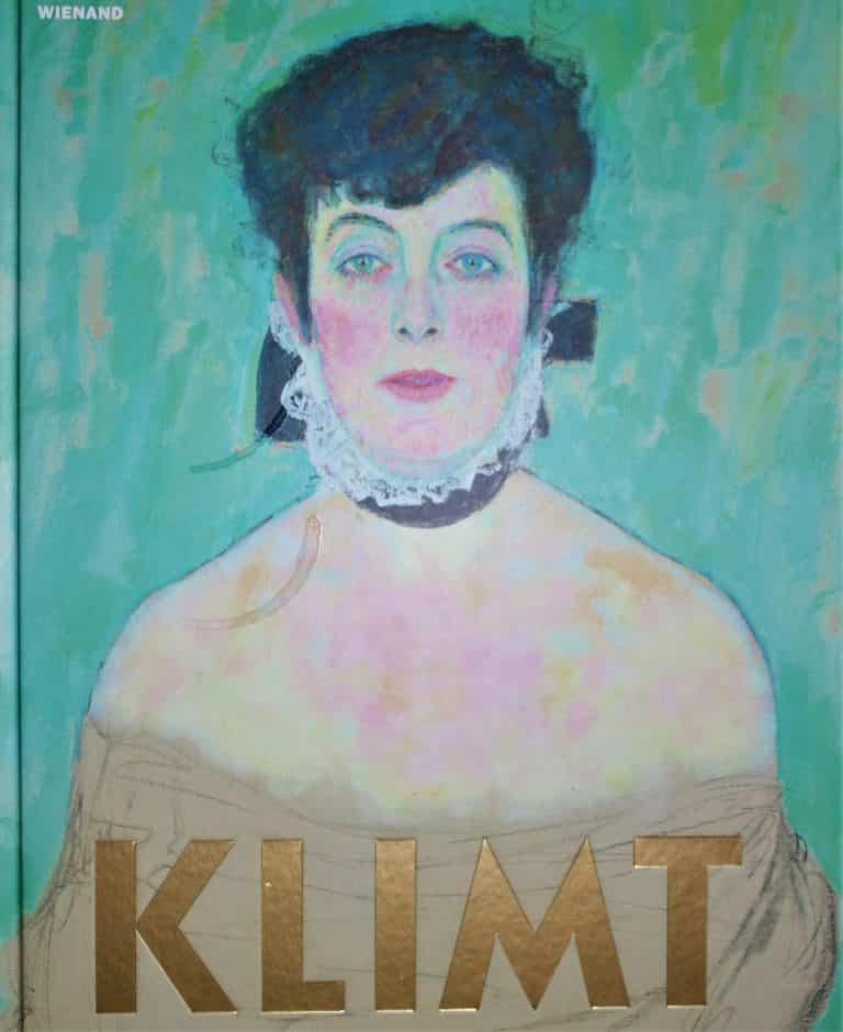 IMG_6575 (2) – Hubertus Boltenhagen Portrait of a woman with light skin and black hair against a green background, "Klimt" is written at the bottom.